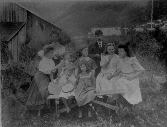 Dorothy Whyte and school friends having tea outdoors in company of Mr. Misumi, c1905