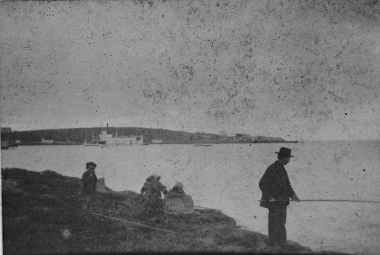 Esquimaux Children and A. Edmons, fishing at St-Michaels, September 29, 1899