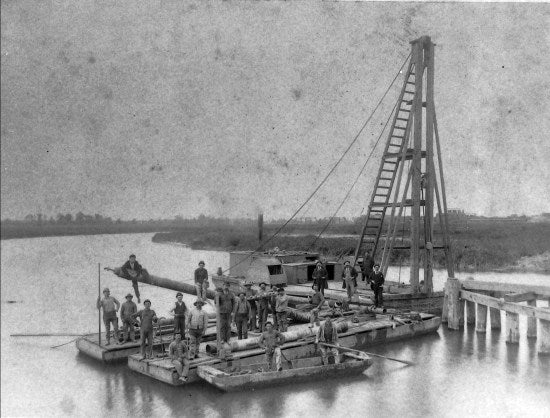 Group Portrait on Barge, c1900.