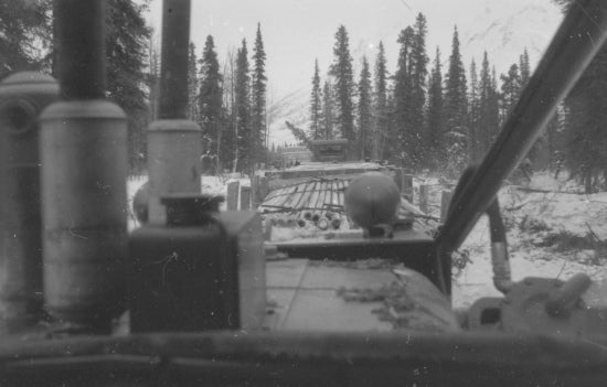 Cat Train Hauling Drill Pipe, c1950.