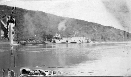 Sternwheeler pushing a Barge, c1913.