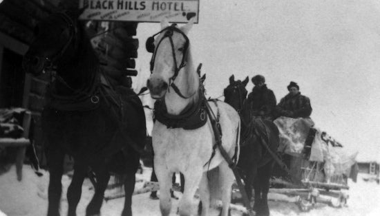 Four Horse Team and Sled, c1915.