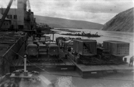 U.S. Army Equipment for Construction of the Alaska Highway at the dock in Dawson City, c1942.
