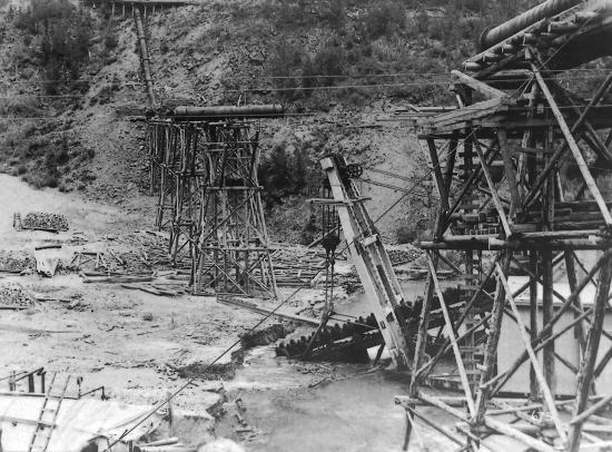 Yukon Gold Company Dredge No. 5 Working under the Bonanza Syphon of the Yukon Ditch, 1911.