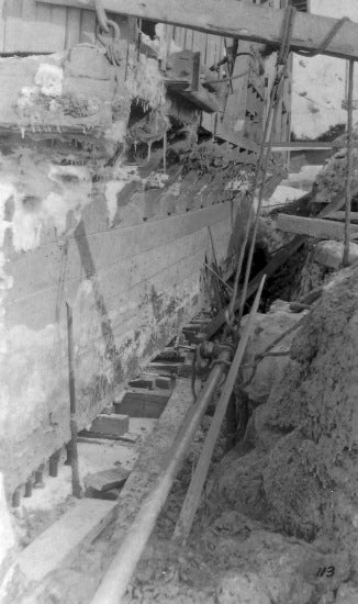 Excavation Along the Hull of Damaged Yukon Gold Company Dredge No. 1, 1913.