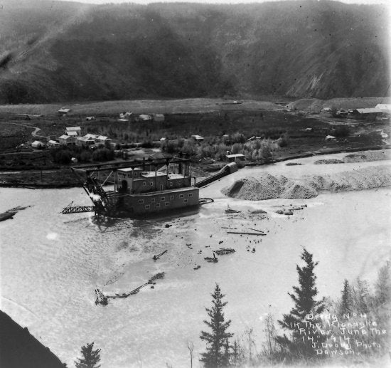 Dredge No 4 on the Klondike River at the mouth of Bonanza Creek., June 14, 1914.