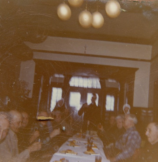 Group of men at a table, n.d.