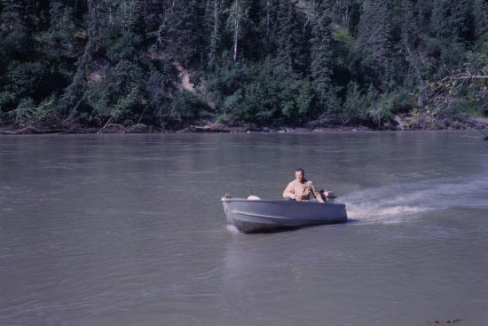 Ed Jones Piloting his Boat Near Coal Creek Below Fortymile, 1965.