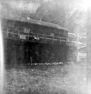 Two Storey Log Cabin, c1900.