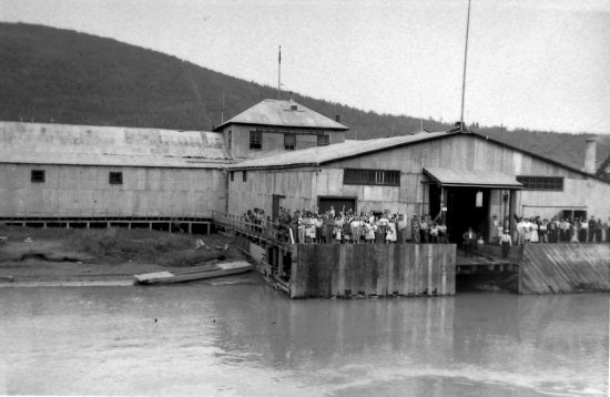 Sternwheeler Docking with Crowd on Dock, c1947.