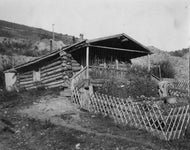 Log Cabin, c1900.