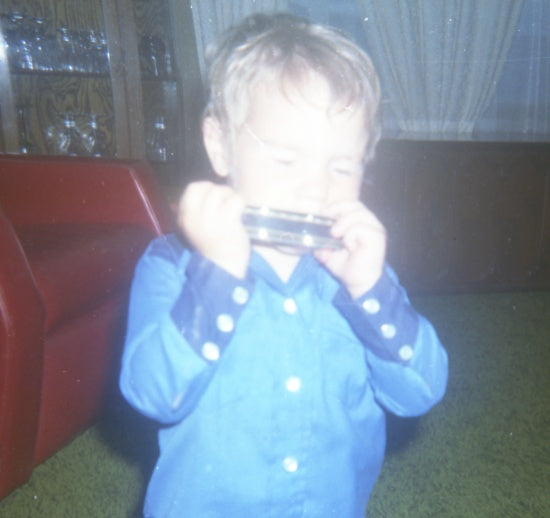 Playing the Harmonica, c1981.