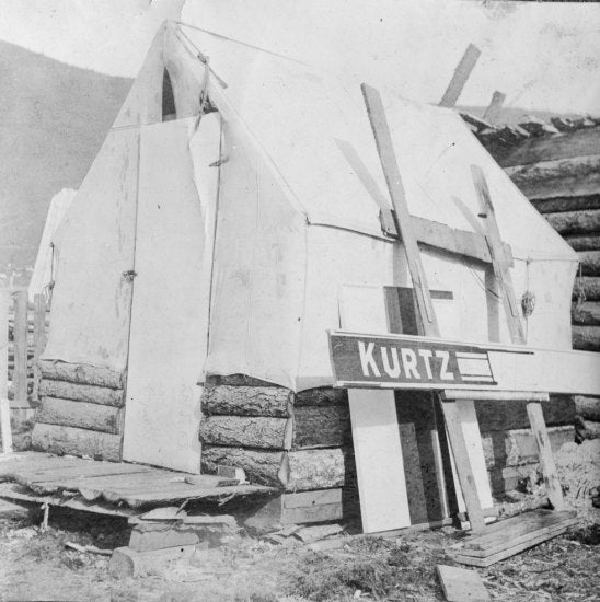 Log Building with Wall Tent Roof c1900.