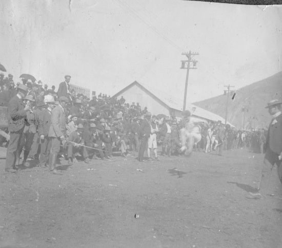 Long Jump Contest on Front Street, c1900.