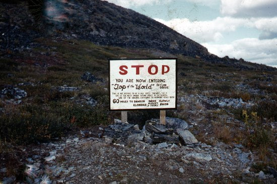 Sign for Top of the World Highway, August 1961.